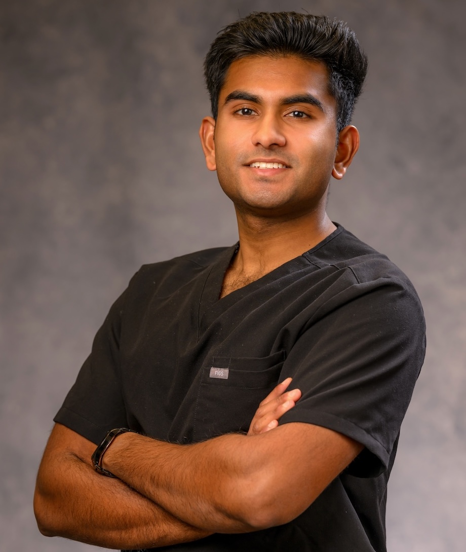 Rohan Shirur healthcare professional in black medical scrubs.jpeg